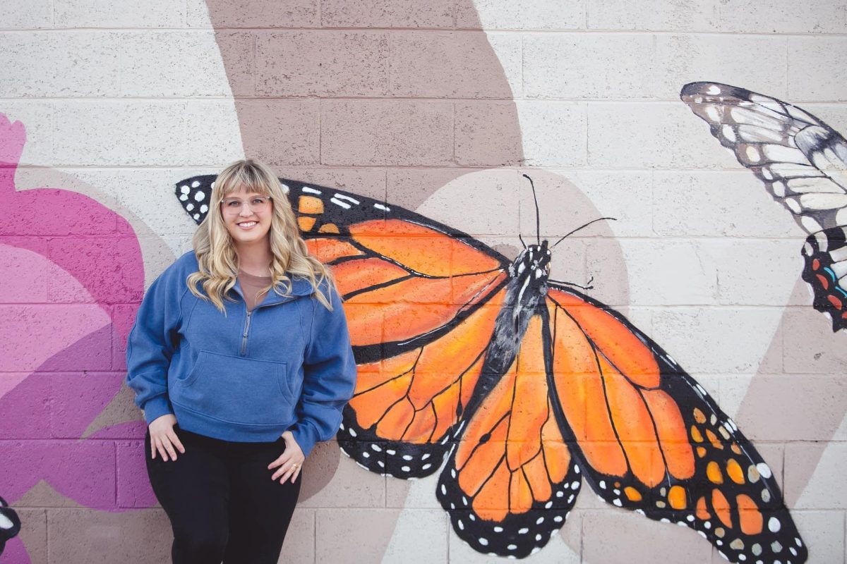 Karly Sivewright in front of butterfly