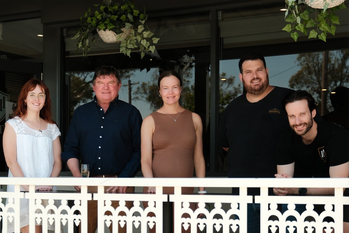 group of people on a hotel veranda