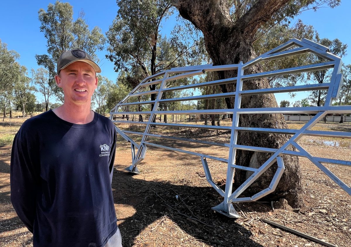 Kyle North-Flanagan with the frame for Wagga's Big Murray Cod that has been restored and is ready for a new 'skin' and a paint job. 