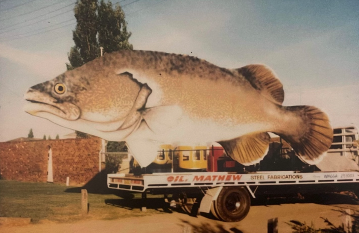 A photo from 1975 shows the original cod aboard a Gil Mathew flatbed truck ready to be taken to its new home.