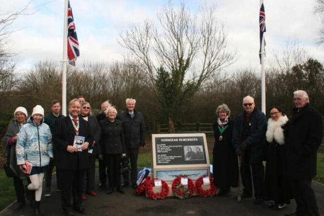 District councillors with members of the Horndean Children of the 1940s group and some of the family members of Ted Wicky and Oswald Mountford at the memorial dedication in 2020. 