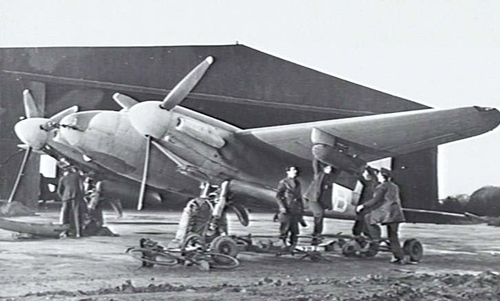 Ground crew "bombing-up" an Australian Mosquito Fighter Bomber in Norfolk England 1943.