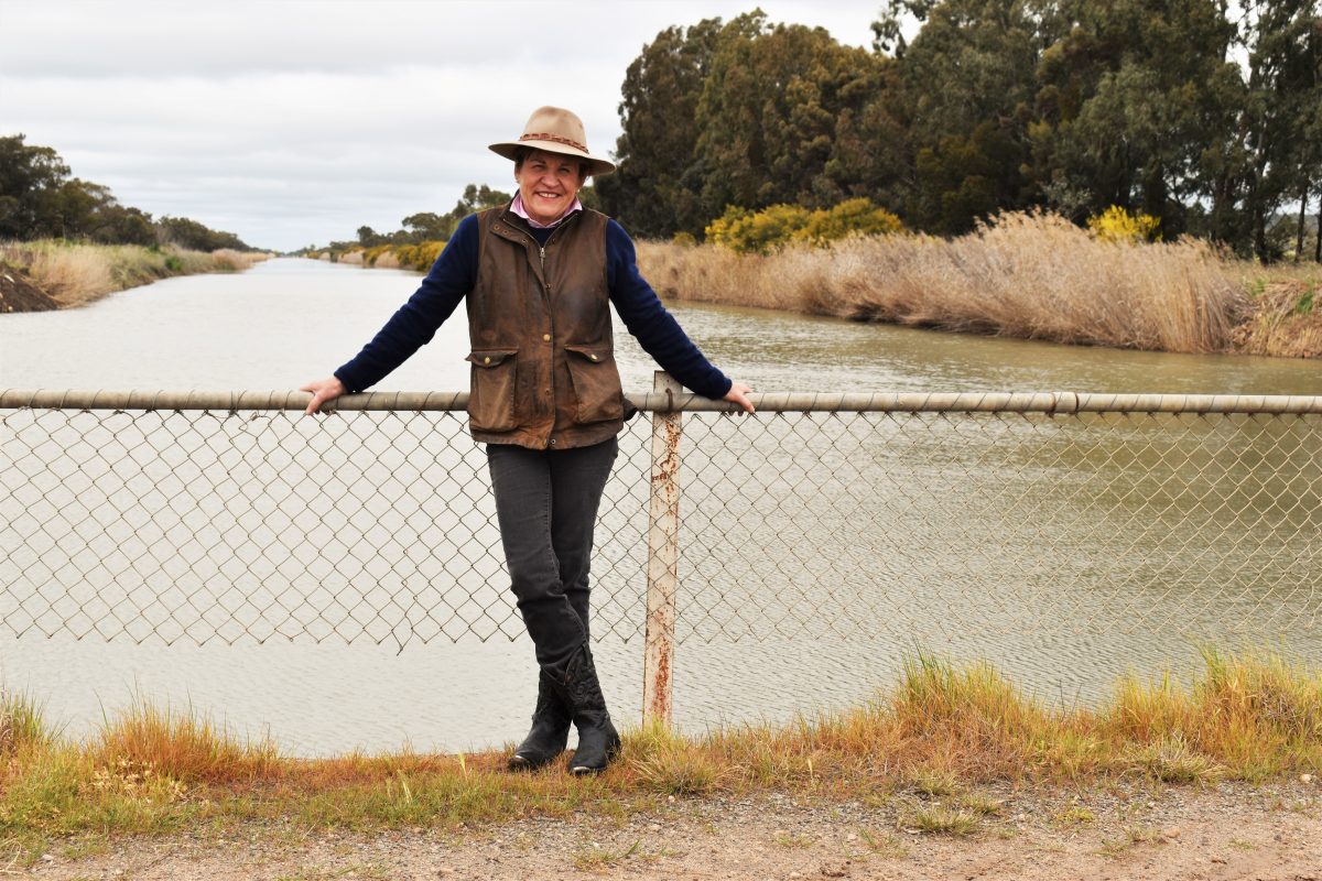 a woman standing near a river