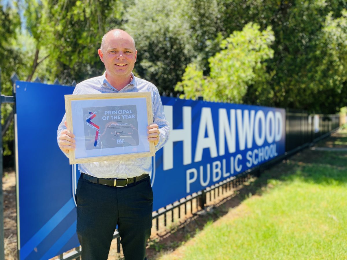 Guy holding award