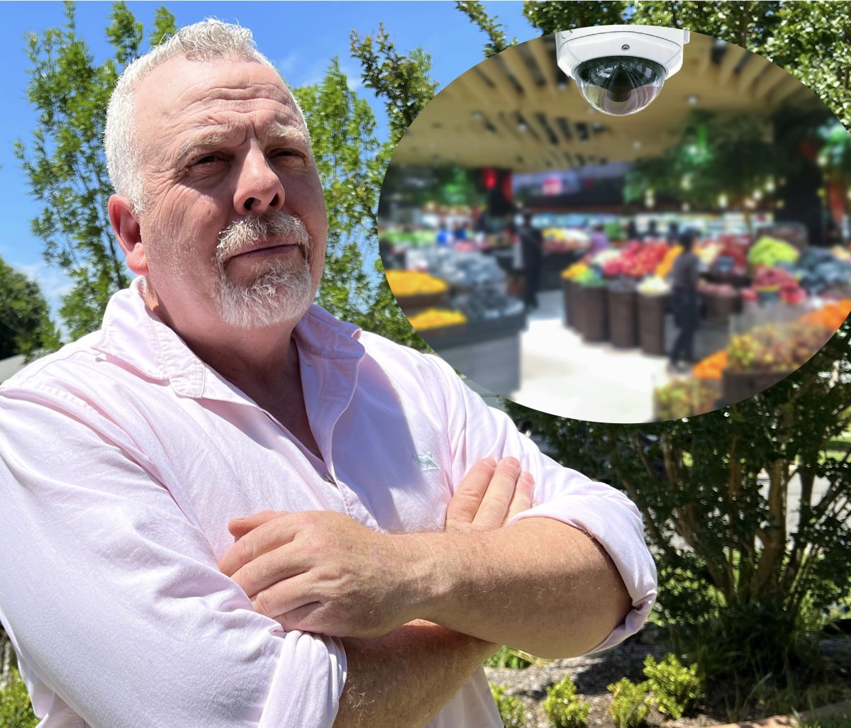 A man standing outside with his arms crossed, and an inset of a CCTV camera in a shop