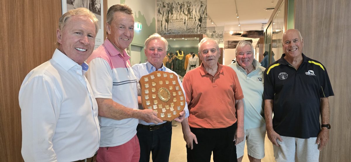 a group of men with a shield