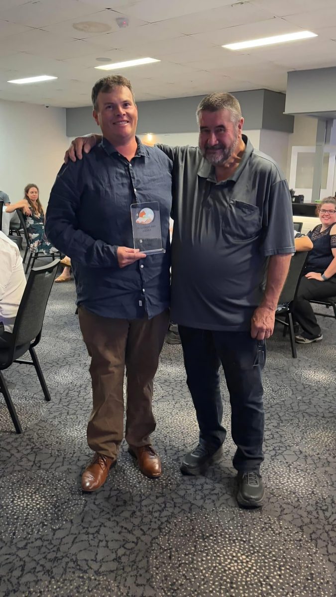 Carl Chirgwin with award