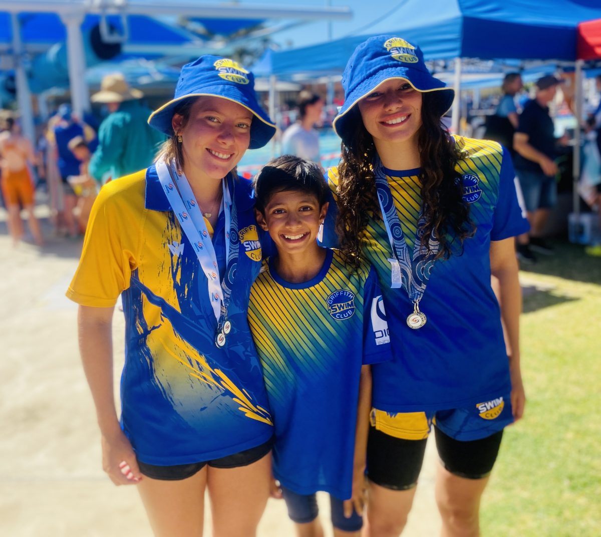 Three swimmers at pool