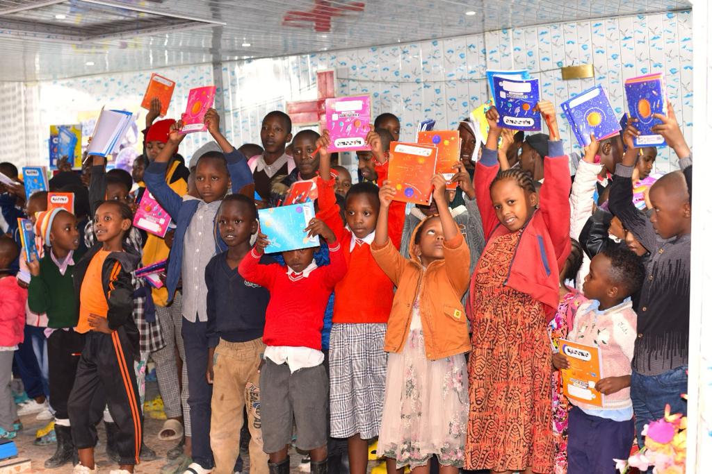 Happy kids in Kenya receive their textbooks and other materials for school through funds raised by the Albury Hume Rotary Club and the Shuka Muhoza Foundation.