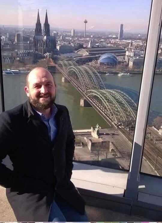 smiling man on observation deck