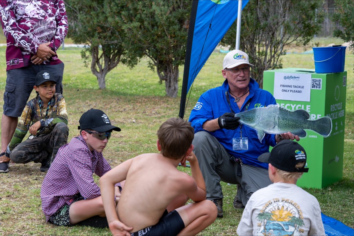 a man giving kids a talk about fishing