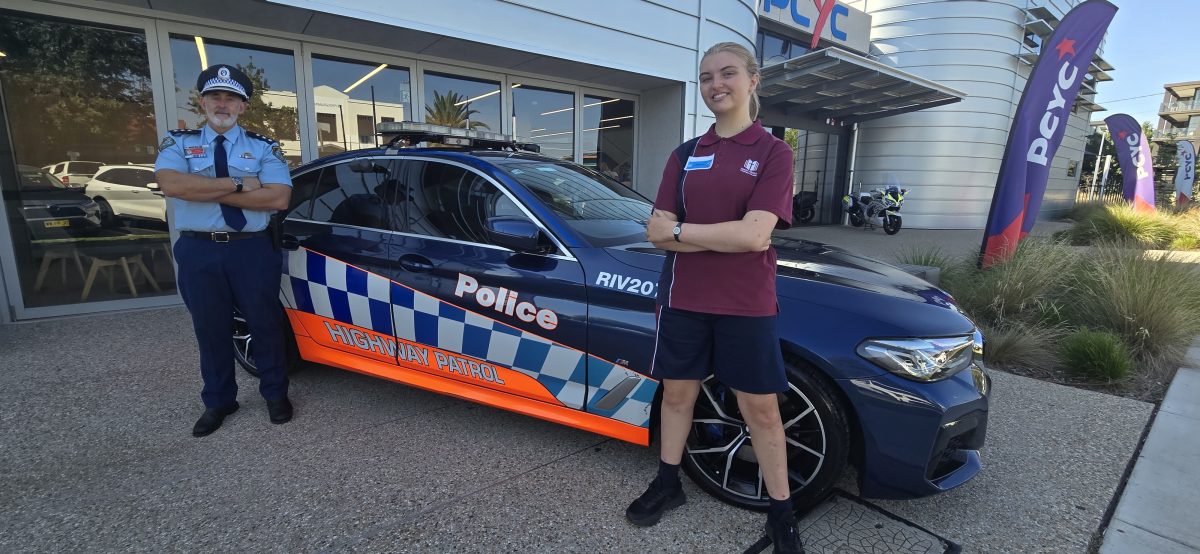 policeman, girl and police car