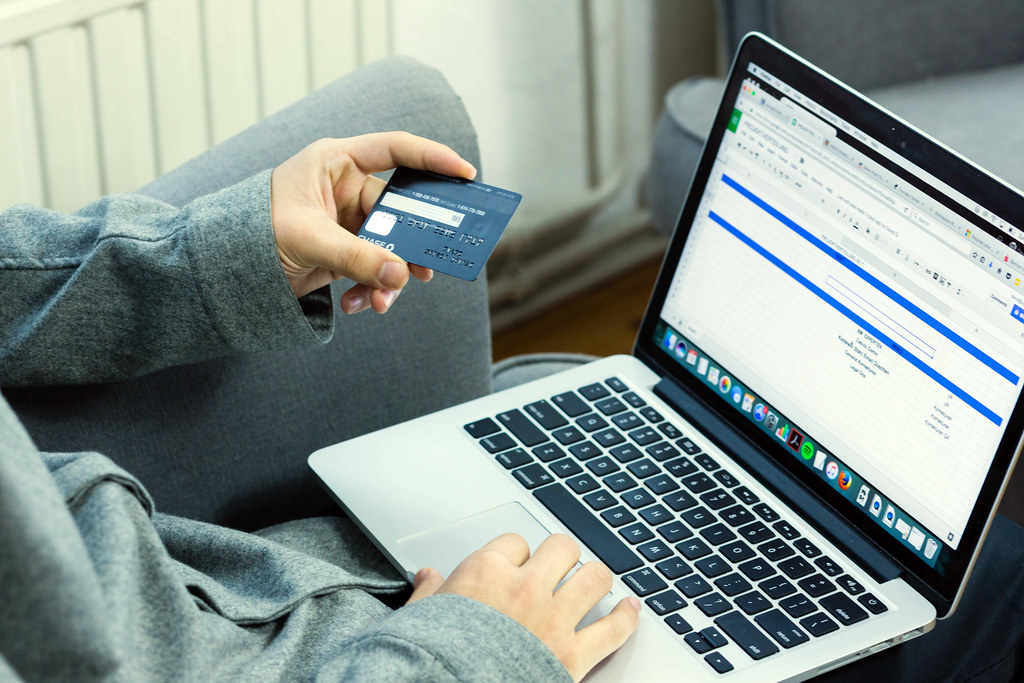 man with credit card and laptop 