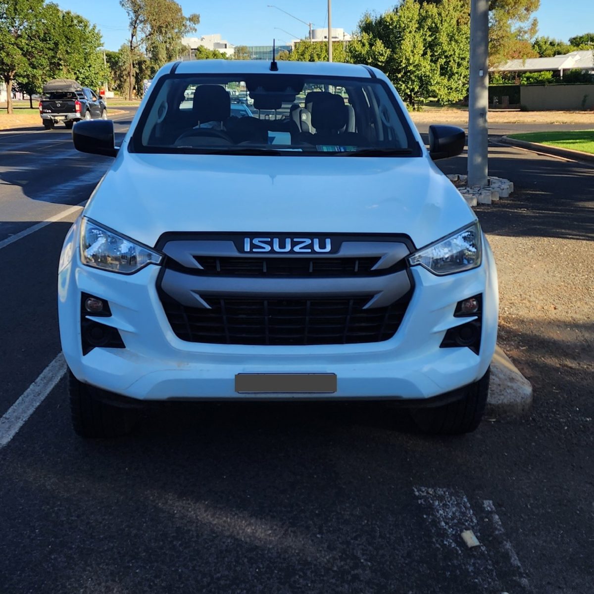 white Isuzu ute 