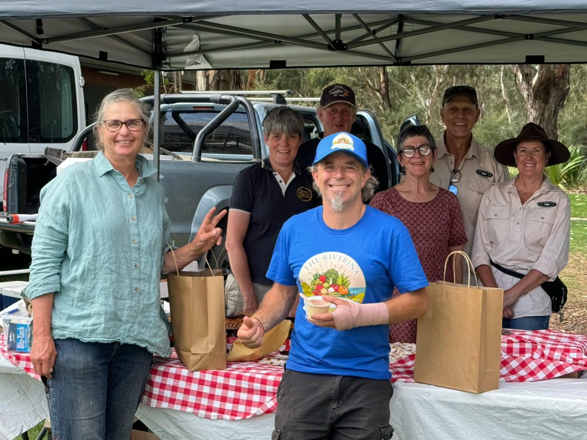 people at a produce festival stall