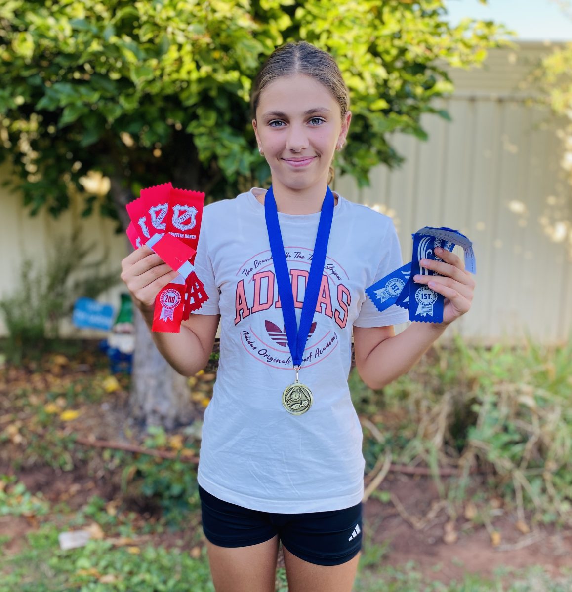 Eleni parading medals 