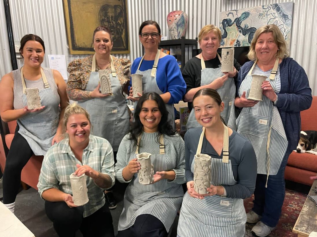 photos of pottery students