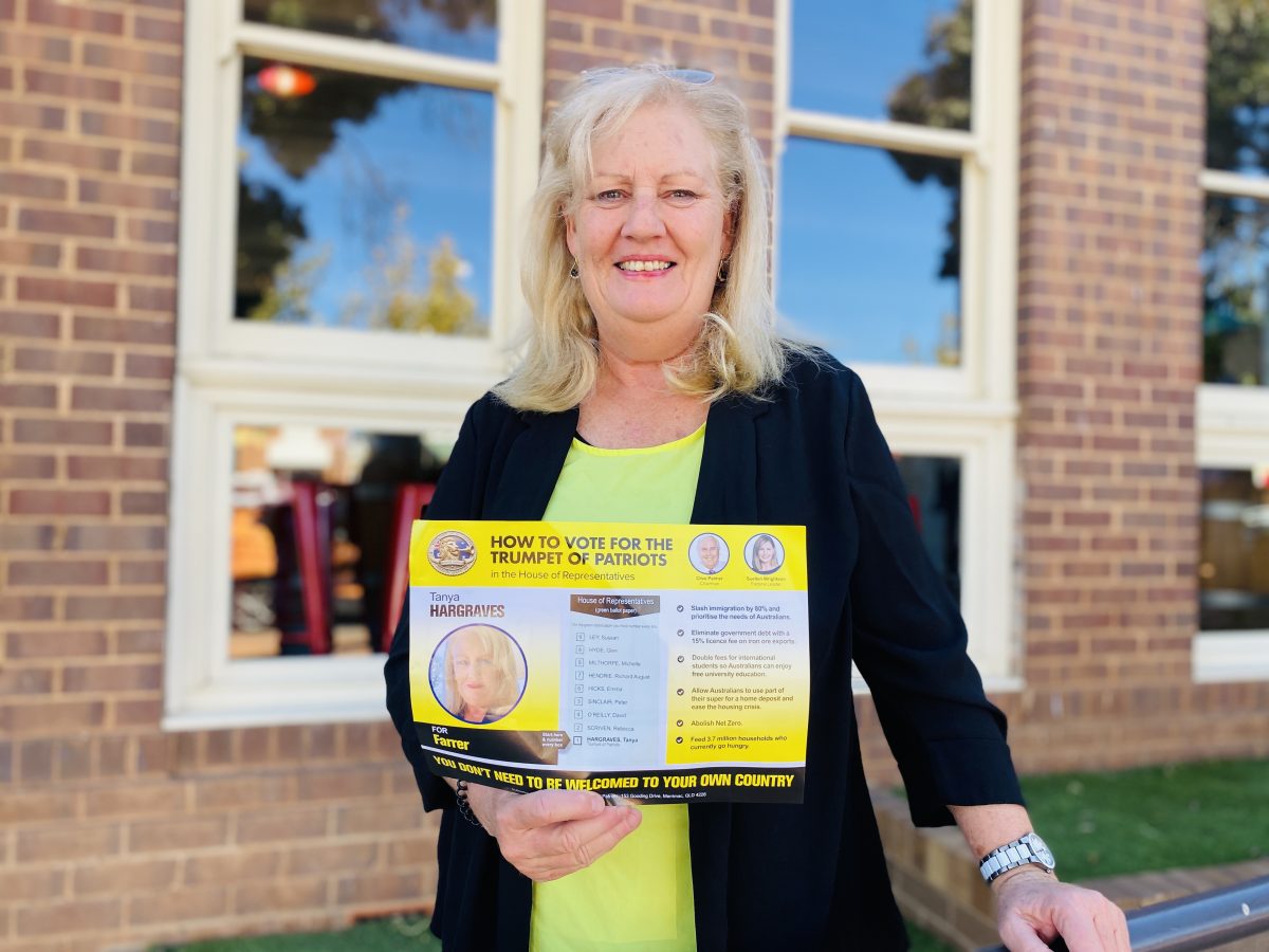 Candidate with her how to vote card