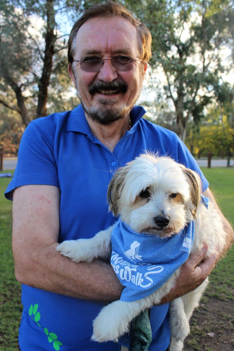 Man holding a dog