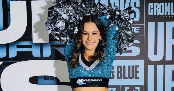 Griffith cheerleader switches from Roosters to Sharks as career takes magic turn