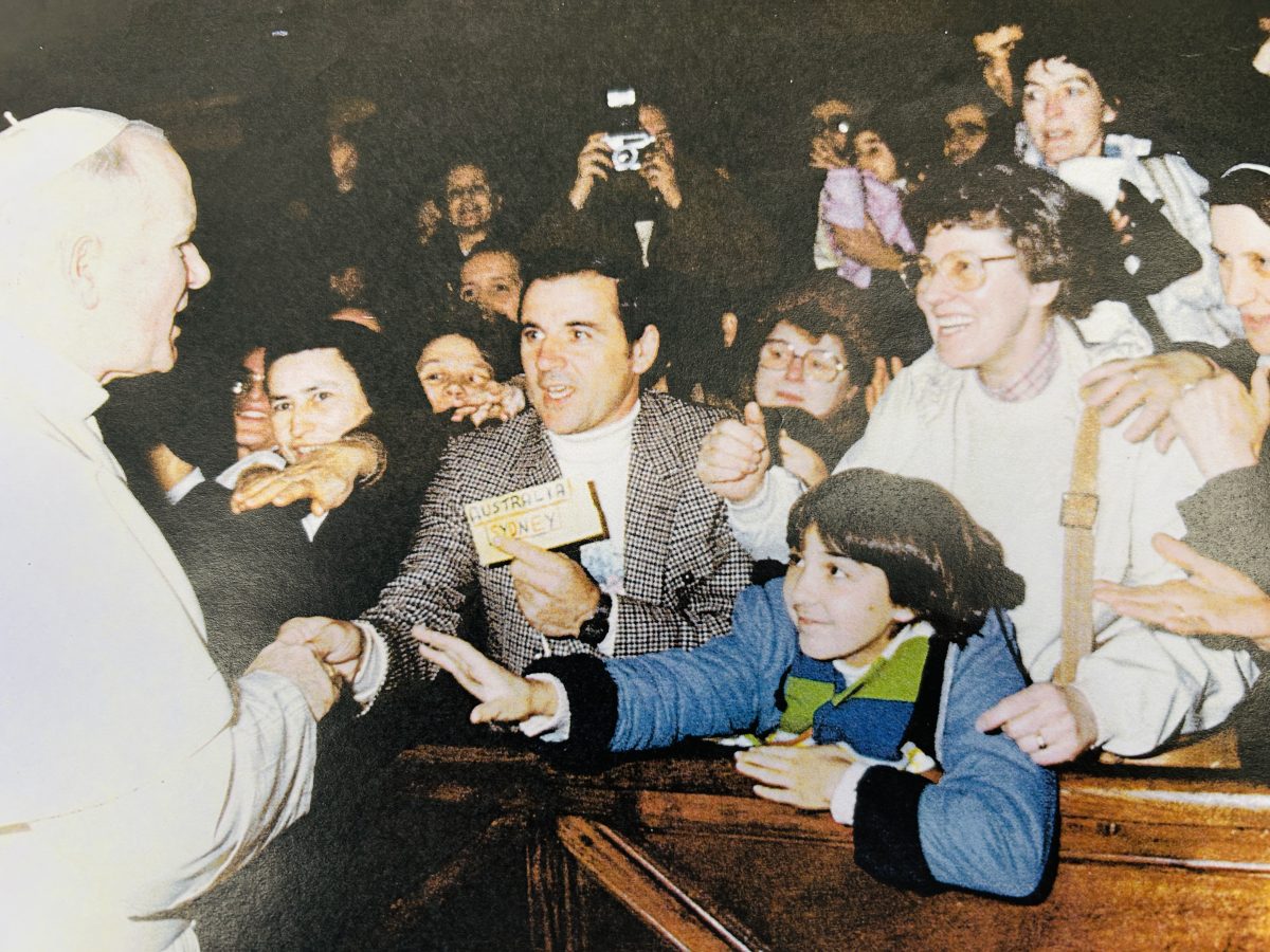 Old photo of a pope meeting people