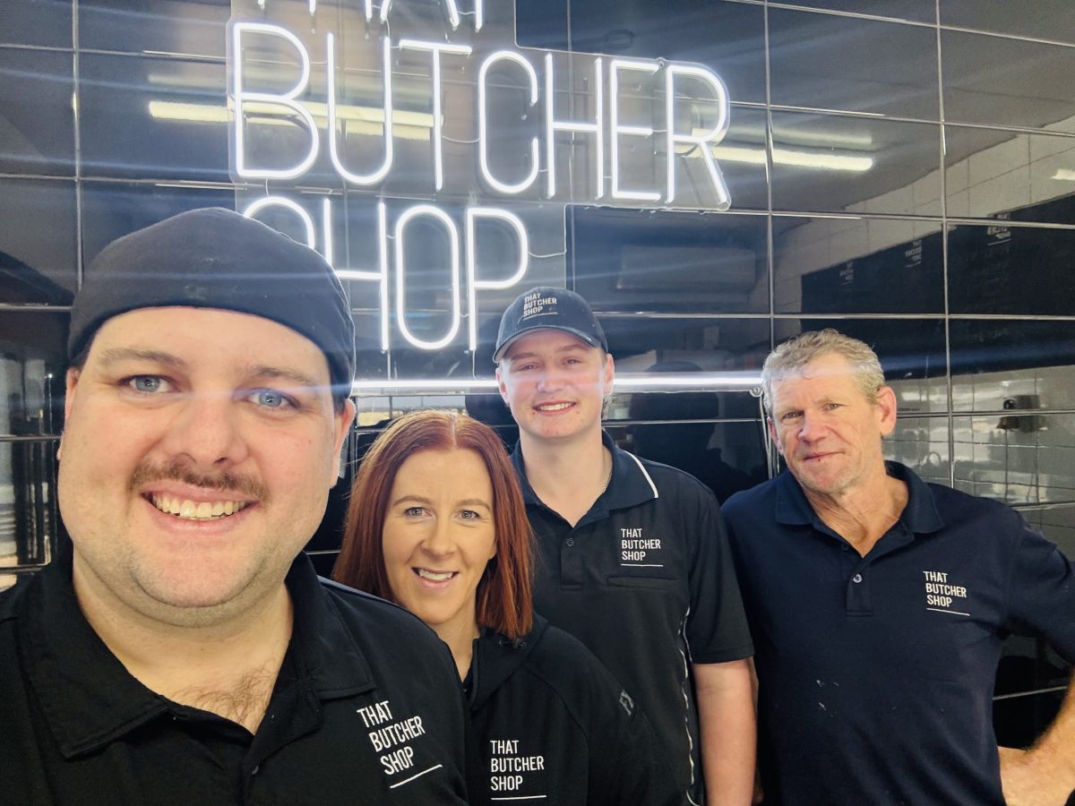 staff outside butcher shop