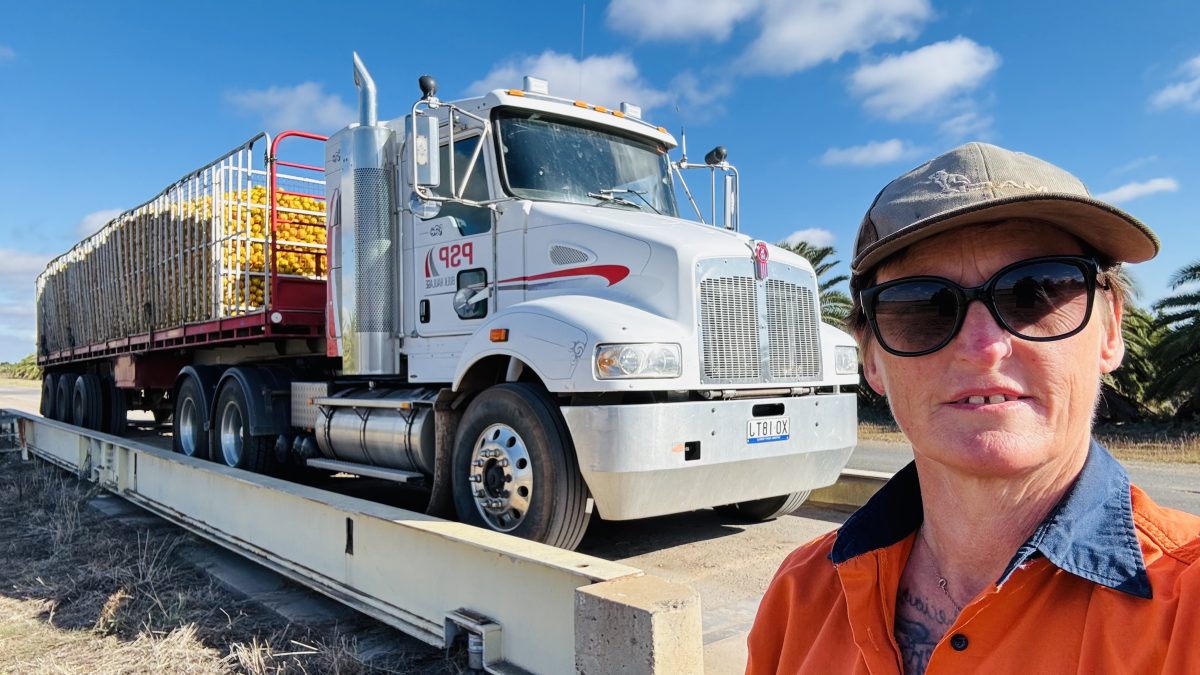 woman in front of truck
