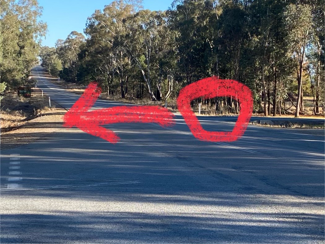 arrow pointing to roadside area
