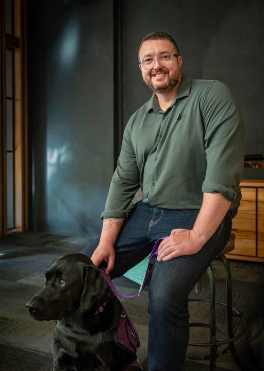 "I'm not going to settle for sitting in front of the television on a disability support pension," says mental health champion and Greens candidate for Farrer Richard Hendrie (pictured with his loyal assistance dog Havic).