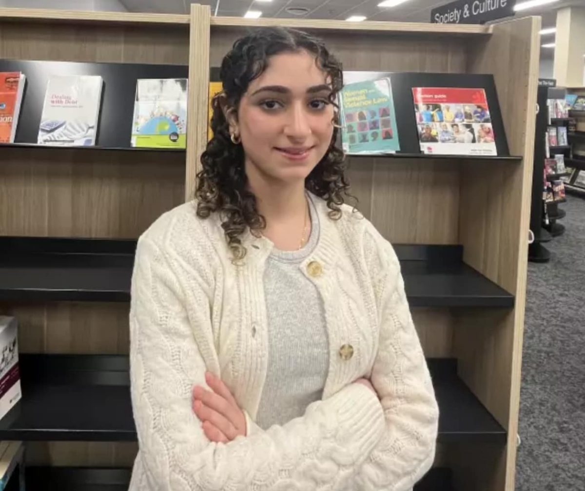 teenage girl with arms folded