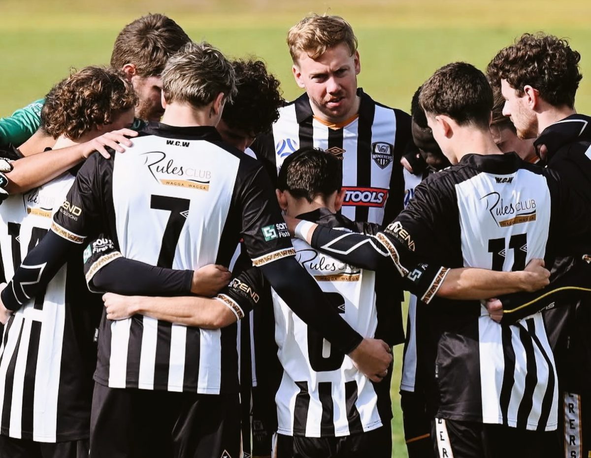 soccer players in a huddle