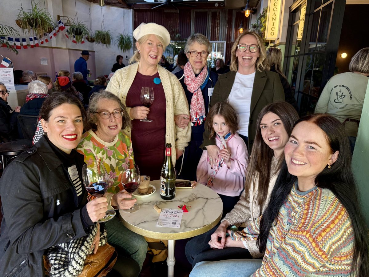 Marguerite McKinnon Sue Savage at the centre of all things French in Wagga, at this year's World Music Day event with (from left) Noellie Bourdoiseau, Kate Gainer, Helena Orel, Sue Savage, Ketura Weston and daughter Poppy, Lyla Foord and Amber Flamank. Photo: Marguerite McKinnon
