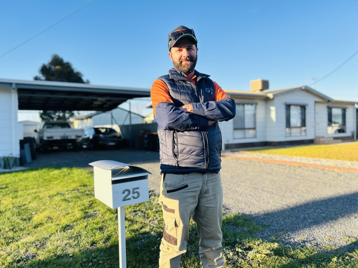 Ben Langford next to mailbox