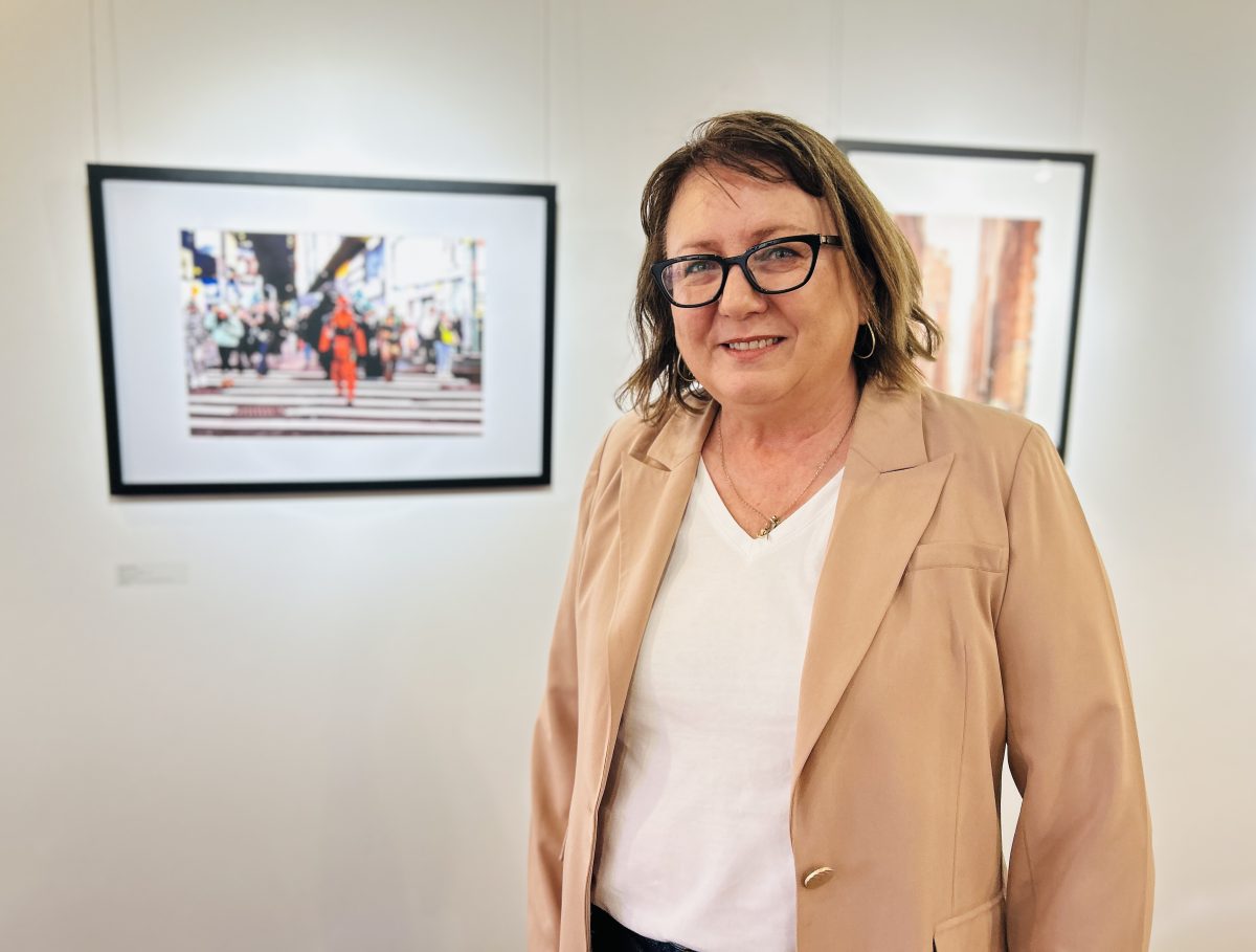 women in front of photography