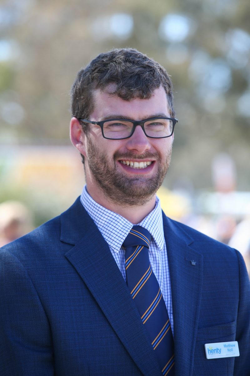 smiling man in suit and tie