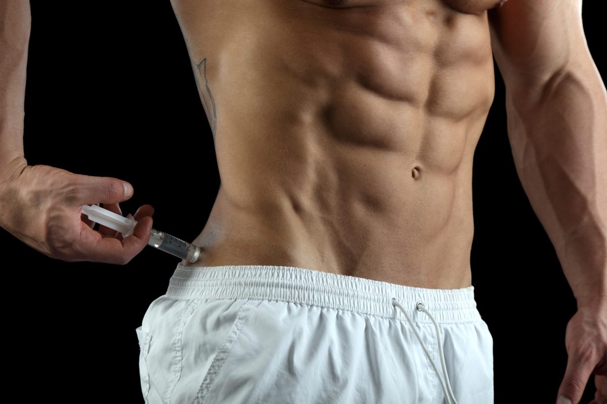 man injecting steroids with needle