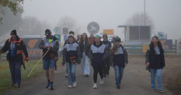Support from rural communities helps mates carry the load on 235 km walk from Walla to Tallimba