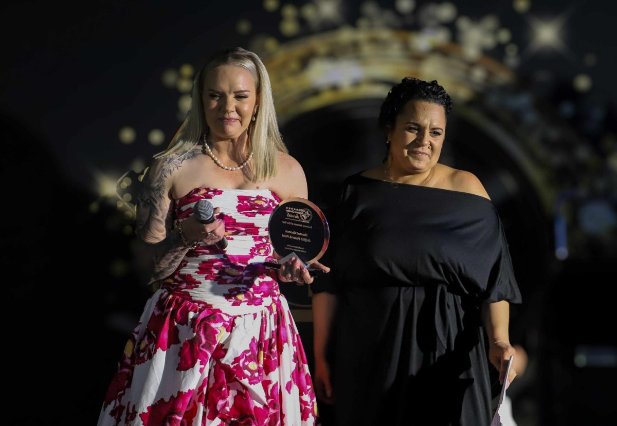 two women at award podium