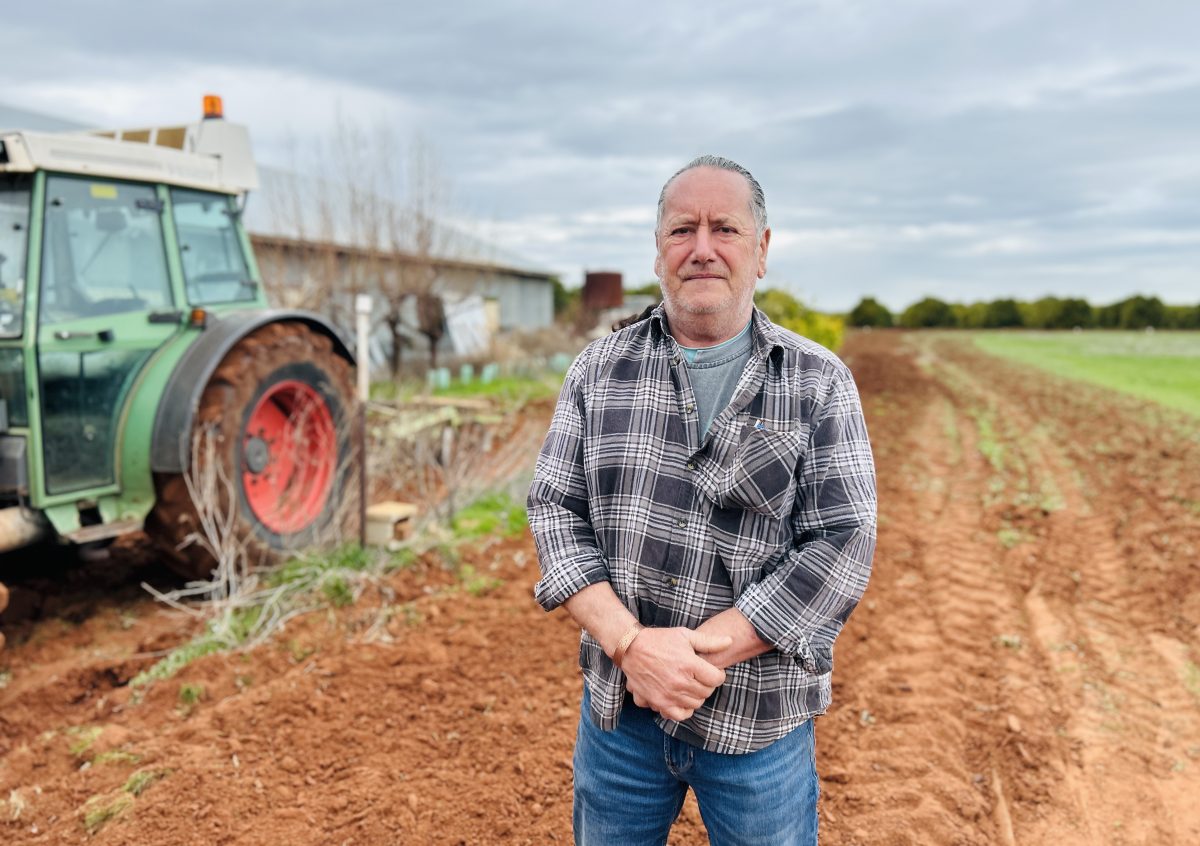 man and machinery on a farm 