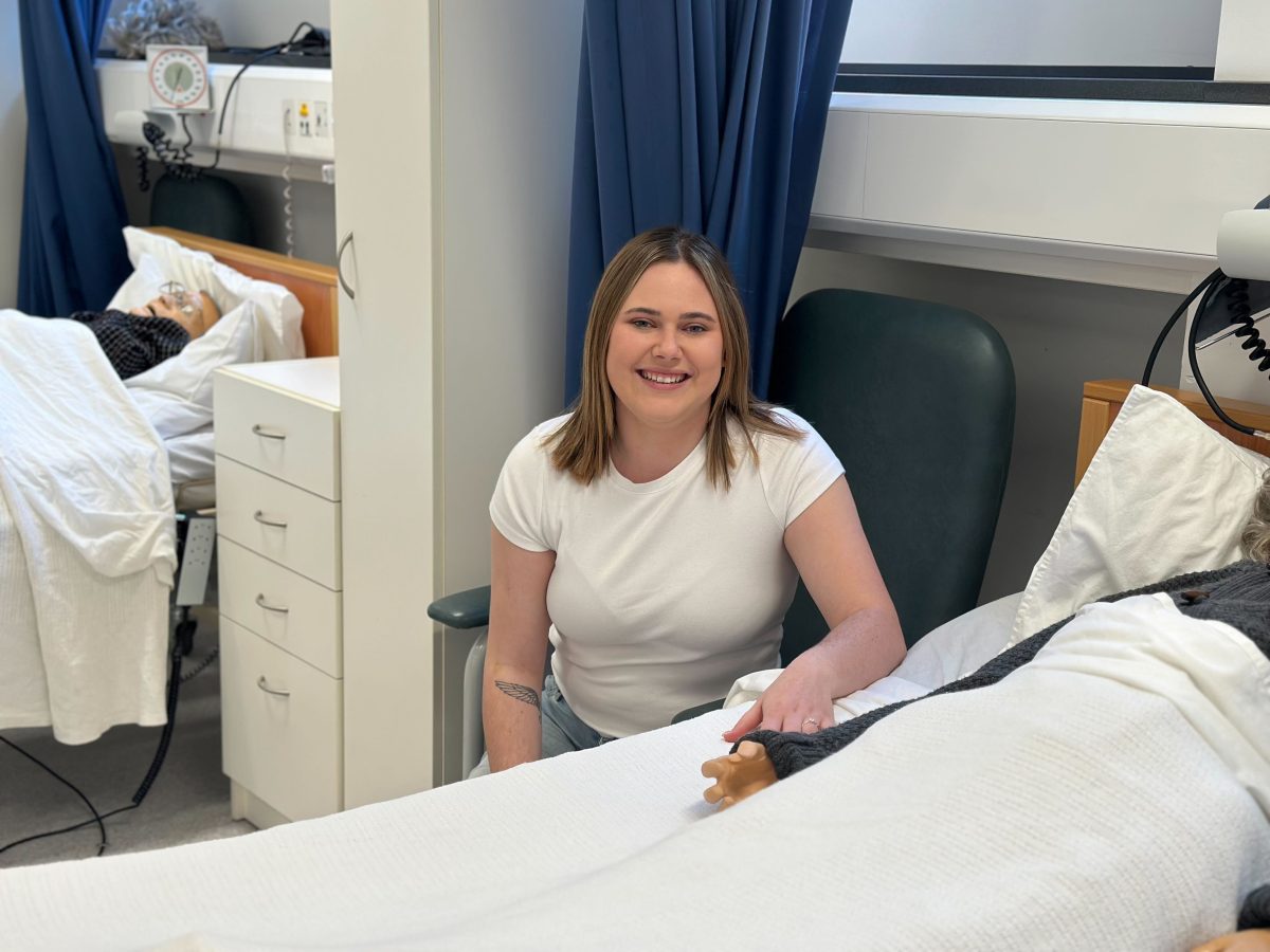 a young woman at a person's bedside