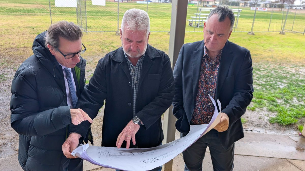 Member for Wagga Wagga Dr Joe McGirr, president of Wagga Rugby League Warren Barclay and Wagga Mayor Dallas Tout go over the plans for the new changerooms.