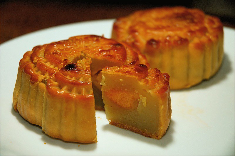 A mooncake is a traditional pastry filled with sweet or savoury fillings. 