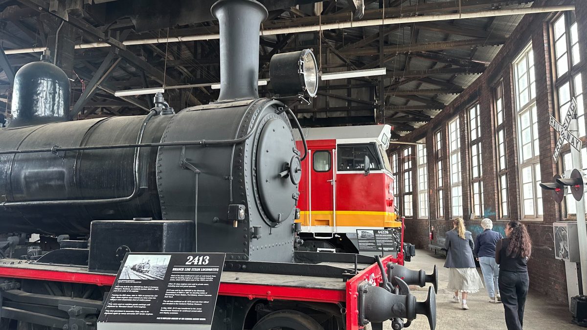 Minimum security inmates assisted with cleaning the tops of the steam engines. 