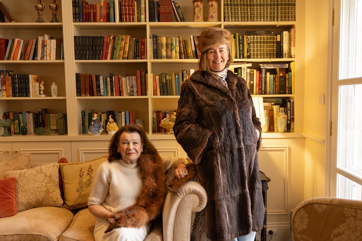 Organisers Elizabeth Newton (left) and Nicola Lawrence don vintage furs that will feature in the upcoming parade, reflecting the elegance of eras past.