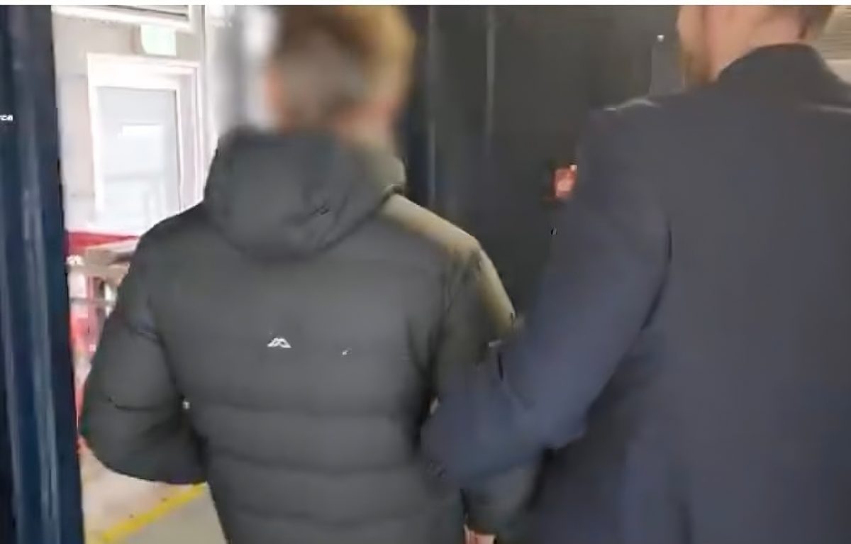 back of man being arrested