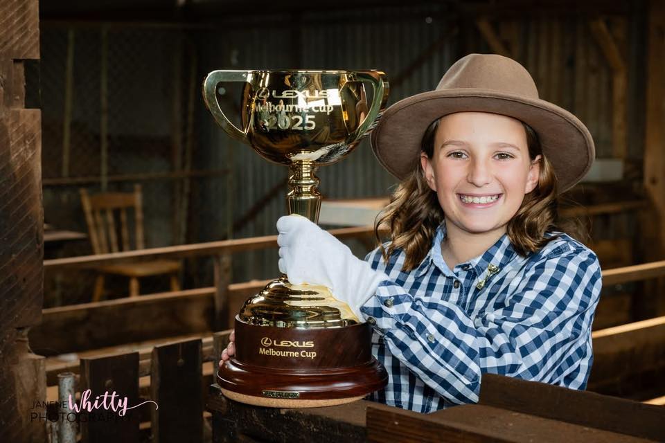 Burrumbuttock Public School student Georgia Mott, 10, was lucky enough to have the Lexus Melbourne Cup visit her school and be part of a photo shoot at a local farm as part of its prestigious tour.