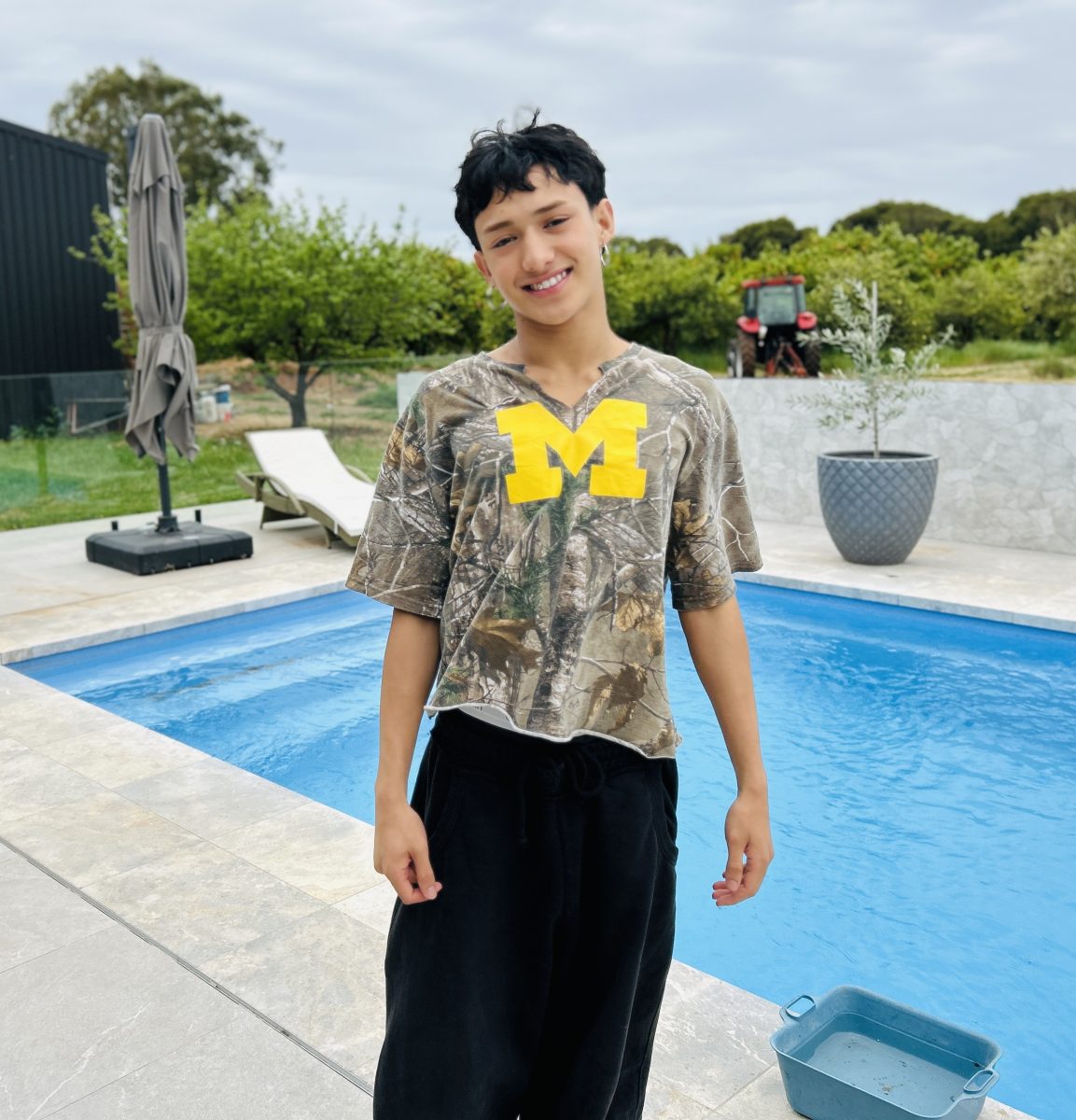 teenage boy by a pool