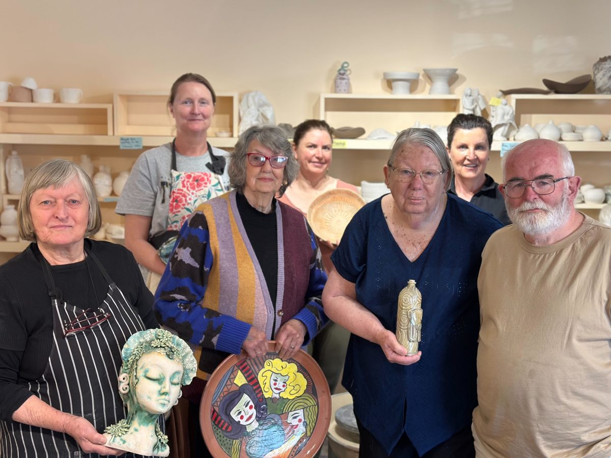 group of potters with their creations