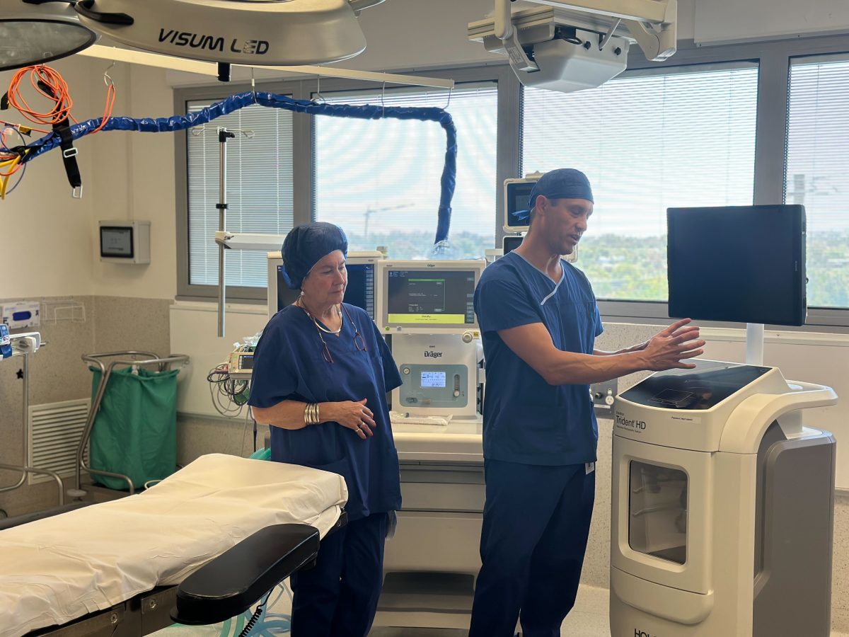 two hospital staff with an imaging machine