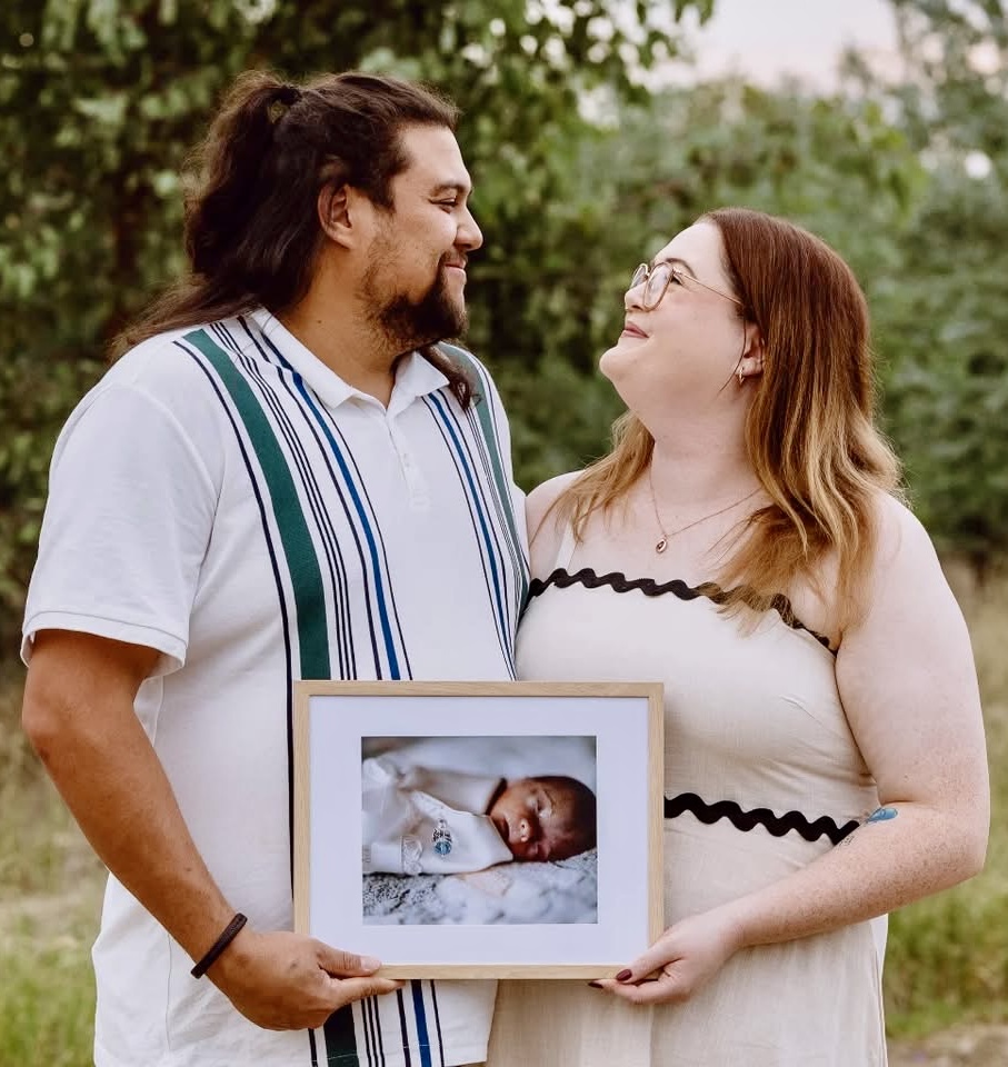 Bradley and Dana Byron with a photo of their son Teddy who would have turned three this week.